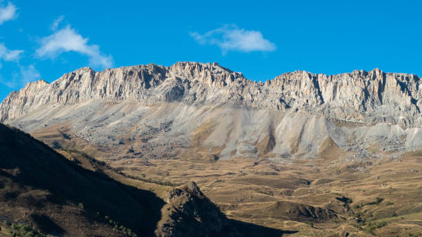 istock Gray mountain range in a sunlight for travel backgrounds 1431241919