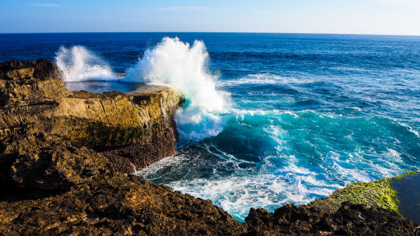 istock Waves crashing on rocks in Devil’s tear on Lembongan island in Bali 1431259280