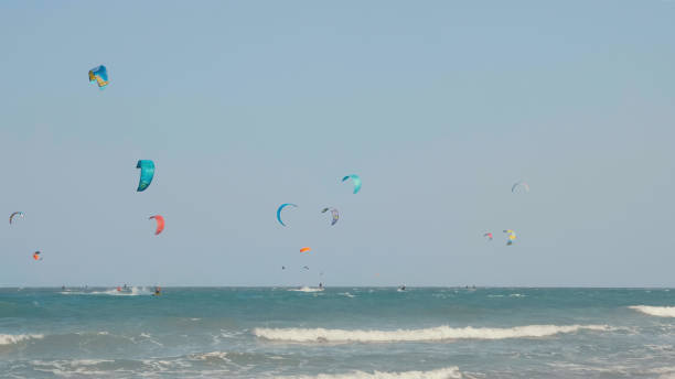 istock Kite surfing or windsurfing on blue sea water 1431272580
