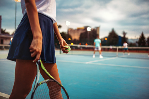 Portrait of happy fit young woman playing tennis at summer. People sport healthy lifestyle concept