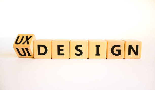 UX user experience design or UI user interface design symbol. Turned wooden cubes and changed words UX design to UI design. Beautiful white background. Business UX or UI design concept. Copy space.