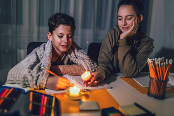 istock Boy and girl studying with a burning candle. 1431282841