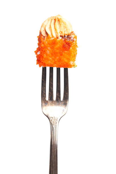 istock Sushi rolls Japanese food on the fork 1431285234