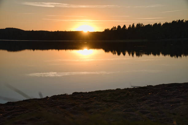 istock Sunset with reflection on a Swedish lake in Smalland. Romantic evening mood 1431285829