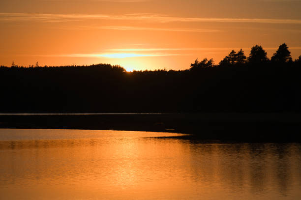 istock Sunset with reflection on a Swedish lake in Smalland. Romantic evening mood 1431285939