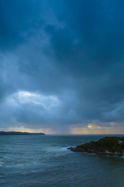 istock Sunrise seascape with overcast sky and rain clouds 1431287941