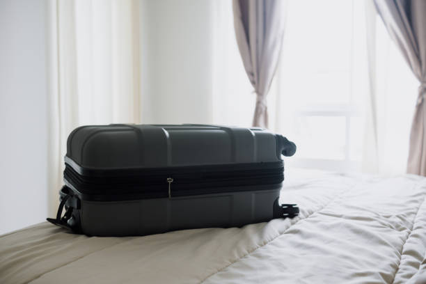 istock Luggage on the bed in the bedroom. 1431290130