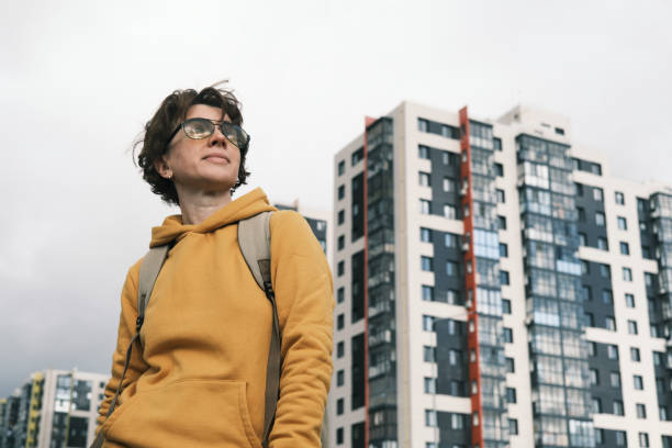 istock Woman is dancing against dramatic sky 1431290720