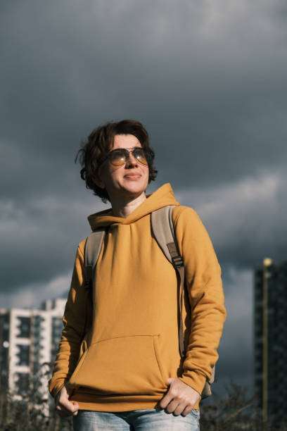 istock Woman is dancing against dramatic sky 1431291048