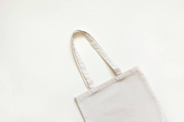 istock Beige cotton bag on a beige background. Natural eco-friendly materials. Top view, Copy space, monochrome. 1431293008