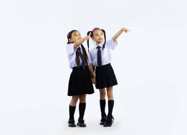 Multiracial teenage boys wearing school shirts and ties on way to class, on the move, punctuality, commitment