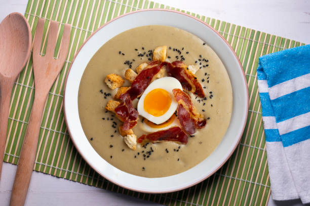 istock Smoked aubergine cream with crispy Iberian ham and boiled egg. 1431308623