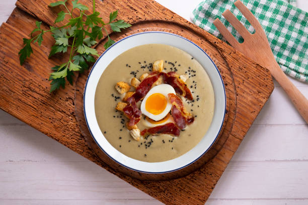 istock Smoked aubergine cream with crispy Iberian ham and boiled egg. 1431308632