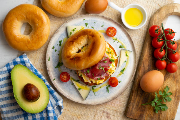 istock Toasted baggel with scrambled egg and Iberian ham and manchego cheese. 1431308846