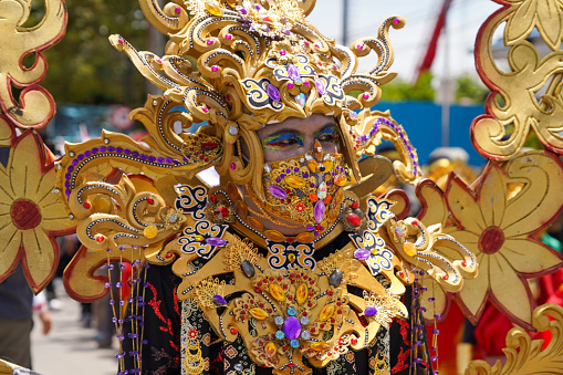 Tarakan, Indonesia - October 06, 2022 : The parade costumes are characterized by colorful Kalimantan (Dayak tribe) culture in Cultural Parade