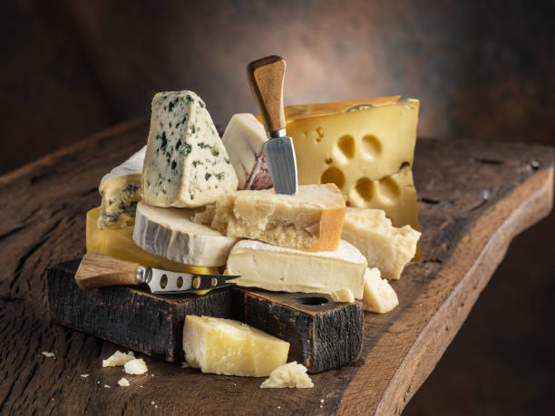 istock Set of different cheeses on old wooden background. 1431311241