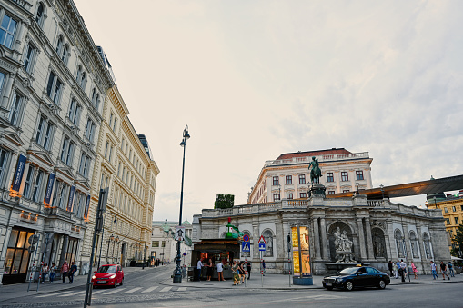 Vienna, Austria - May 29, 2020: The buildings along Lichtenfelsgasse in Vienna are lit by the setting sun. Viennese  City Hall is opposite these buildings.