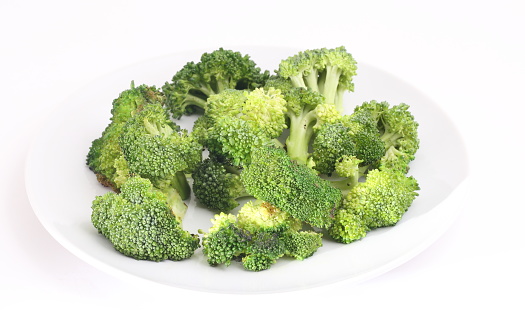 Grilled broccoli on white background
