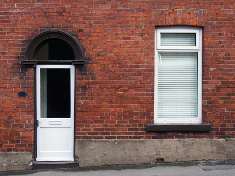 sidewalk by street wall & door