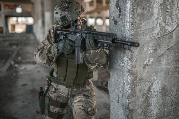 istock Strong special forces woman soldier in war zone targets the target 1431318567
