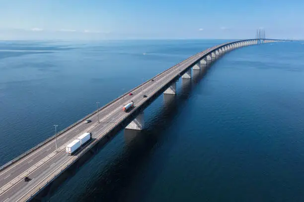 Semi-truck with trailer and a fuel truck on the Öresund bridge between Malmö in Sweden and Copenhagen in Denmark.