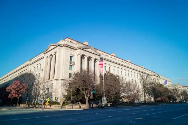 The United States Department of Justice Robert F. Kennedy Building on a winter day from the intersection of Constitution Avenue NW and 10th Street NW in downtown Washington, DC.