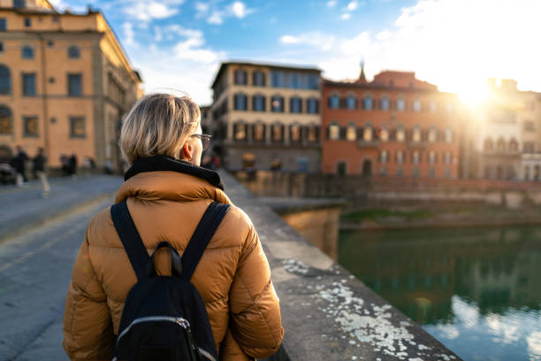istock Tourist watching Arno river at sunset 1431323778