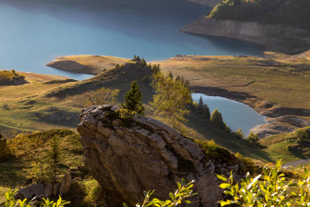 Lac de Roselend, Savoie, France on September 20, 2022: Lake Roselend Reservoir in the Frenche Alps in the evening sun