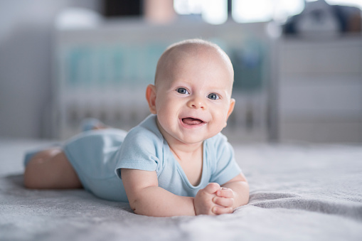 Portrait of the seetest joyful baby boy in the world.