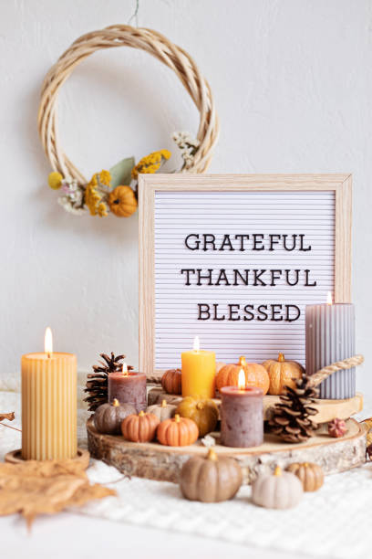 istock Felt letter board and text grateful, thankful, blessed. Autumn table decoration. Floral interior decor for fall holidays with handmade pumpkins 1431326611