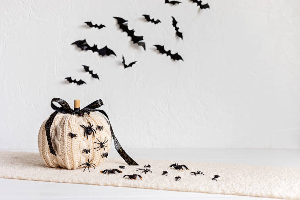 istock Modern interior decoration for halloween celebration with handmade knit pumpkin, spiders, bats 1431326671