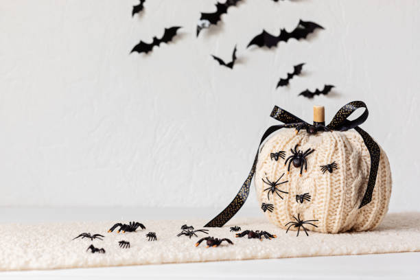 istock Modern interior decoration for halloween celebration with handmade knit pumpkin, spiders 1431326700