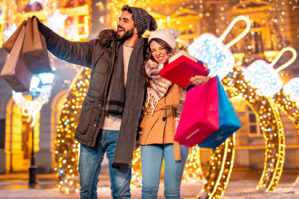 istock Couple doing Christmas shopping, buying presents 1431328909