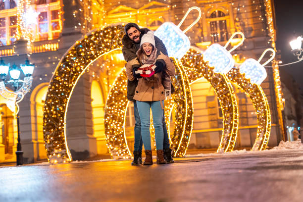 istock Couple hugging and exchanging Christmas presents 1431329640
