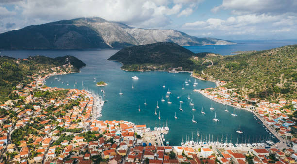 Aerial view to the bay of Vathi, Ithaca, Greece Aerial view on sailboats in Vathy bay, Ithaca (Ithaka), Greece. ulysses stock pictures, royalty-free photos & images
