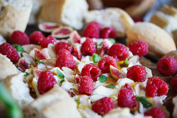 istock Butter board topped with fresh raspberries, figs, sliced almonds, basil leaves 1431331118