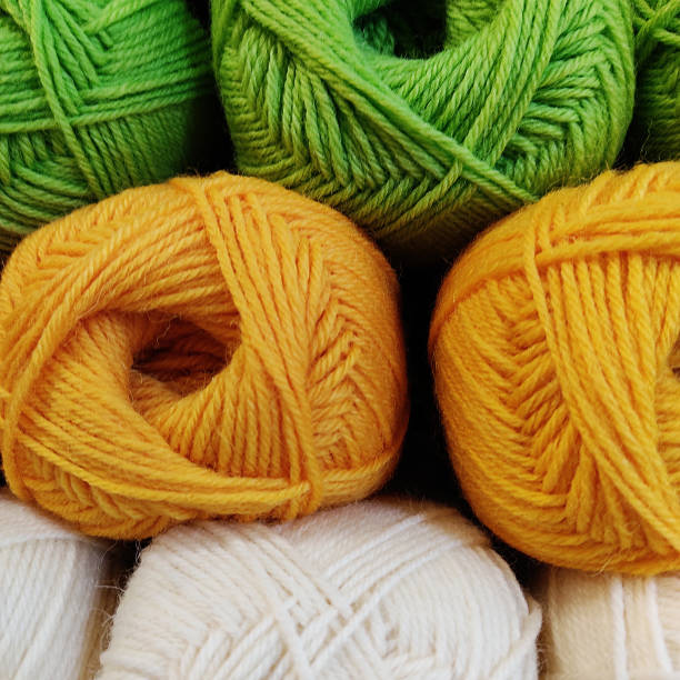 white yellow and green grey wool balls full frame