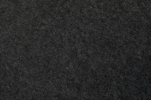Close-up of an anthracite colored felt surface