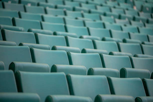 The empty seats of the stadium await match day