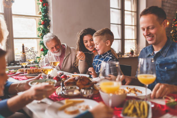 istock Family gathered around the table for Christmas dinner 1431334095