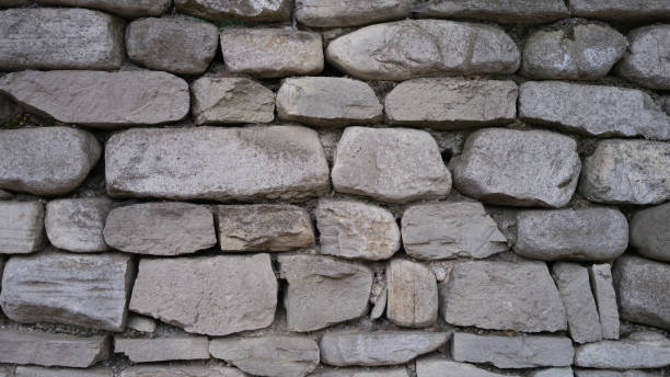 istock Stone old wall fencing seamless texture closeup 1431346581