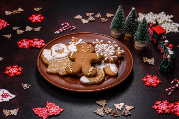istock Christmas decoration elements as well as gingerbread on a brown concrete background 1431347479