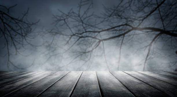 istock Spooky misty horror halloween background with empty wooden planks, ideal for product placement 1431347610