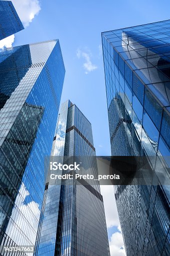 istock Bottom view of modern skyscrapers in business district. 1431347663