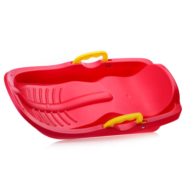istock Children's plastic Red sled isolated on a white background. Sleds for skiing downhill in winter. Children's toys. Slide board 1431350276