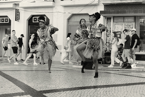 Lisbon, Portugal - July 2, 2022: a group of african dancers, perform at the Rua Augusta street in Lisbon downtown.