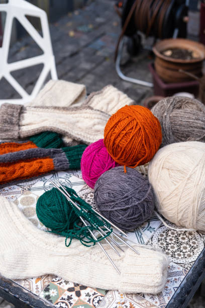 istock pile of yarn, wool, balls and knitting needles lying on the table 1431351021