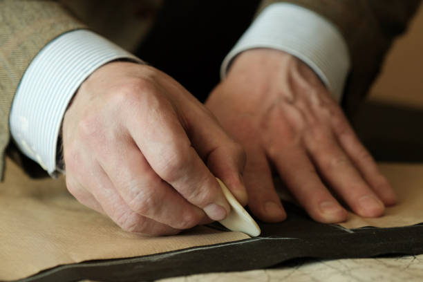 istock Sewing workshop. The hands of a tailor master. Close-up. 1431351222