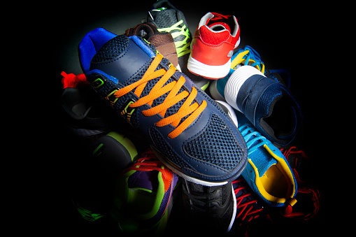 Sport shoes. Various sneakers on a dark background.