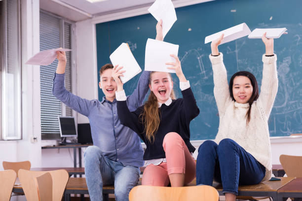 istock Cheerful teen students in auditorium 1431353161